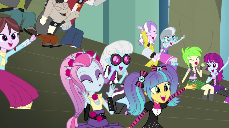 Size: 1280x714 | Tagged: safe, derpibooru import, screencap, cherry crash, diamond tiara, fido, mystery mint, photo finish, pixel pizazz, rover, silver spoon, spot, velvet sky, violet blurr, equestria girls, rainbow rocks, background human, cheering, diamond dudes, sitting, the snapshots