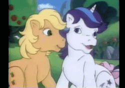 Size: 455x320 | Tagged: safe, derpibooru import, screencap, applejack (g1), glory, earth pony, pony, unicorn, rescue at midnight castle, animated, bow, cute, face licking, female, g1, glorybetes, horses doing horse things, jackabetes, licking, mare, silly, silly pony, tail bow