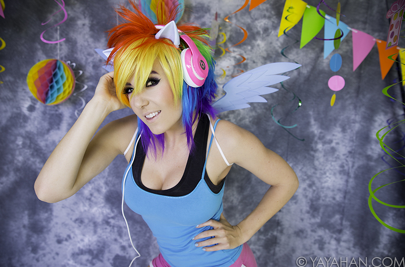 Size: 900x595 | Tagged: cleavage, clothes, cosplay, derpibooru import, female, headphones, human, irl, irl human, jessica nigri, photo, safe, tanktop, wings