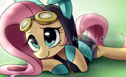 Size: 1039x630 | Tagged: safe, artist:rocy canvas, derpibooru import, fluttershy, pegasus, pony, bunny ears, clothes, costume, cute, dangerous mission outfit, female, goggles, green background, hoodie, looking at you, mare, pixiv, prone, shyabetes, simple background, smiling, solo, watermark