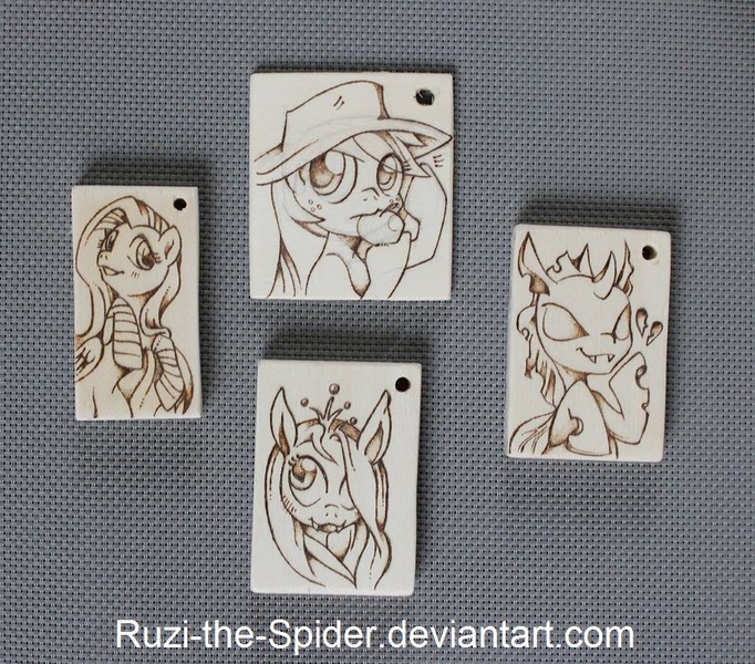 Size: 960x845 | Tagged: apple, applejack, artist:ruzi-the-spider, changeling, clothes, derpibooru import, fluttershy, heart, pendant, pyrography, queen chrysalis, safe, socks, traditional art, woodwork