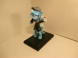 Size: 4608x3456 | Tagged: safe, artist:earthenpony, derpibooru import, trixie, pony, aiden pearce, baseball cap, bipedal, clothes, hat, irl, jacket, mobile phone, parody, phone, photo, sculpture, solo, watch dogs
