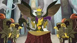 Size: 1911x1072 | Tagged: safe, derpibooru import, screencap, king grover, gryphon, the lost treasure of griffonstone, crown, crown of grover, griffon guard, history of griffonstone, idol of boreas, jewelry, majestic, regalia, spread wings, wings