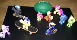 Size: 953x500 | Tagged: apple bloom, applejack, artist:drpain, blind bag, blues, derpibooru import, flash sentry, flash sentry adventures, irl, lilac hearts, noteworthy, photo, pursey pink, rainbow dash, safe, skateboard, skateboarding, thunderclap, toy, wensley