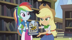 Size: 1280x719 | Tagged: safe, derpibooru import, edit, edited screencap, screencap, applejack, rainbow dash, giratina, kyurem, fanfic, equestria girls, friendship games, bedroom eyes, book, inverted mouth, pokémon, we like this book, yearbook meme