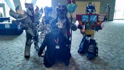 Size: 960x541 | Tagged: bronycon, bronycon 2015, clothes, cosplay, derpibooru import, fursuit, g.i. joe, hasbro, human, irl, irl human, king sombra, megatron, oc, optimus prime, photo, safe, snake eyes, transformers, transformers prime