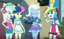 Size: 871x536 | Tagged: safe, derpibooru import, screencap, bon bon, lyra heartstrings, rainbow dash, sweetie drops, trixie, velvet sky, equestria girls, friendship games, background human, chs rally song, clothes, hat, headphones, necklace, pony ears, skirt