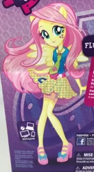 Size: 630x1153 | Tagged: safe, derpibooru import, fluttershy, equestria girls, friendship games, box art, canterlot high, high heels, merchandise, necktie, outfit, school spirit, solo, wondercolts