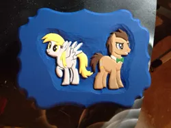 Size: 1024x765 | Tagged: safe, artist:spikefiremane, derpibooru import, derpy hooves, doctor whooves, time turner, pony, carving, charity, craft, custom, duo, irl, male, photo, stallion, woodwork