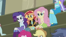 Size: 1280x720 | Tagged: safe, derpibooru import, screencap, applejack, aqua blossom, curly winds, fluttershy, microchips, pinkie pie, rarity, some blue guy, sunset shimmer, equestria girls, friendship games, background human, boots, chs rally song, clothes, cowboy hat, hat, high heel boots, jewelry, sitting, skirt