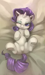 Size: 2380x3936 | Tagged: suggestive, artist:mrs1989, derpibooru import, rarity, bed, blushing, crotch bulge, cute, featureless crotch, female, looking at you, on back, overhead view, raribetes, sheet, solo, solo female, spread legs, spreading, tongue out, underhoof, wink