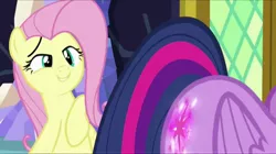 Size: 856x480 | Tagged: safe, derpibooru import, screencap, fluttershy, twilight sparkle, twilight sparkle (alicorn), pony, the hooffields and mccolts, booty call, eyes on the prize, female, glowing cutie mark, mare, out of context, plot