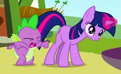 Size: 641x390 | Tagged: safe, derpibooru import, screencap, spike, twilight sparkle, dragon, pony, unicorn, too many pinkie pies, cropped, eyes closed, female, glowing horn, gritted teeth, magic, magic aura, mare, open mouth, wide eyes