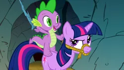 Size: 1366x768 | Tagged: safe, derpibooru import, screencap, spike, twilight sparkle, dragon, pony, a dog and pony show, annoyed, bridle, dragons riding ponies, frown, glare, open mouth, raised eyebrow, reins, riding, rock, rope, smiling, tack, twilight is not amused, unamused