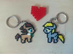 Size: 4224x3168 | Tagged: safe, artist:bliknia, derpibooru import, derpy hooves, doctor whooves, time turner, pony, bead sprite, beads, doctorderpy, heart, irl, keychain, male, photo, shipping, stallion, straight