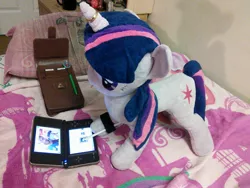 Size: 2592x1944 | Tagged: artist needed, bed, derpibooru import, dsi, glasses, horn ring, human, irl, irl human, jin, nintendo ds, photo, plushie, safe, the legend of zelda, triforce, twilight sparkle