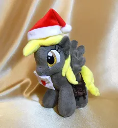 Size: 720x780 | Tagged: safe, artist:1stastrastudio, derpibooru import, derpy hooves, pegasus, pony, female, hat, irl, letter, mailmare, mare, photo, plushie, saddle bag, santa hat, solo, traditional art