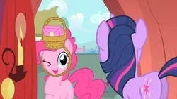 Size: 1280x720 | Tagged: basket, basket hat, candle, derpibooru import, door, hat, one eye closed, party of one, pinkie pie, safe, screencap, smiling, twilight sparkle, wink