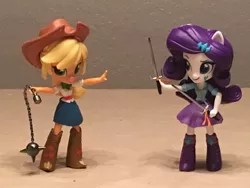 Size: 1024x768 | Tagged: safe, artist:mayorlight, derpibooru import, applejack, rarity, equestria girls, clothes, doll, equestria girls minis, eqventures of the minis, flail, sai, skirt, toy, weapon