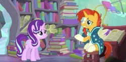 Size: 711x352 | Tagged: safe, derpibooru import, screencap, starlight glimmer, sunburst, pony, unicorn, the crystalling, book, bookmark, bookshelf, clothes, crystal empire, cute, cutie mark, eye contact, female, frown, glasses, glimmerbetes, gritted teeth, horn, male, mare, messy mane, reunion, robe, scroll, sitting, smiling, socks (coat marking), stallion, stool, sunburst's glasses, sunburst's house, sunburst's robe