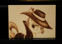 Size: 1280x909 | Tagged: artist:horseez, derpibooru import, detective, pyrography, rarity, safe, solo, woodwork