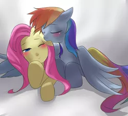 Size: 937x852 | Tagged: safe, artist:shiroryo, derpibooru import, fluttershy, rainbow dash, blushing, cuddling, ear bite, female, flutterdash, hug, lesbian, prone, shipping, snuggling, winghug