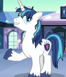 Size: 536x625 | Tagged: safe, derpibooru import, screencap, shining armor, alicorn, pony, the crystalling, cracked armor, derp, exhausted, grin, male, messy mane, raised hoof, smiling, solo, stallion, stubble