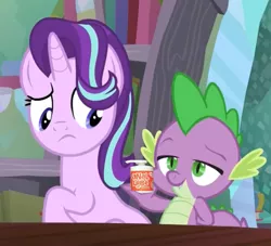 Size: 1200x1091 | Tagged: suggestive, derpibooru import, edit, edited screencap, screencap, spike, starlight glimmer, dragon, pony, unicorn, the crystalling, bedroom eyes, book, female, from behind, implied anal, implied sex, lube, male, mare, shipping, smiling, sparlight, straight, table, teeth, tonight you