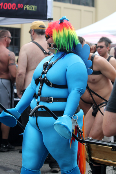 Size: 3456x5184 | Tagged: artist:quinndombrowski, bdsm, bondage, brony, chubby, clothes, cosplay, costume, crotch bulge, derpibooru import, exhibitionism, folsom street fair, glasses, hat, human, human exhibitionism, human nudity, irl, irl human, leather, nudity, panties, photo, pony play, public, questionable, rainbow dash, saddle, shorts, spandex, straps, thong, underwear