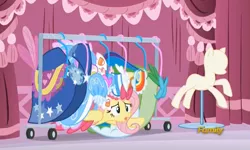 Size: 728x437 | Tagged: clothes, derpibooru import, discovery family logo, dress, fluttershy, froufrou glittery lacy outfit, gala dress, hiding, safe, screencap, solo, the saddle row review