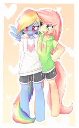 Size: 1500x2400 | Tagged: safe, artist:apony, derpibooru import, fluttershy, rainbow dash, semi-anthro, arm hooves, bipedal, blushing, clothes, cute, cutie mark, cutie mark on clothes, dashabetes, digital art, female, flutterdash, gradient background, heart, hoodie, image, lesbian, png, shipping, shorts, shy dashie, shyabetes, sweater, sweatershy, yellow background