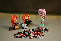 Size: 2736x1824 | Tagged: safe, derpibooru import, fluttershy, sunset shimmer, equestria girls, boots, clothes, doll, duality, equestria girls minis, eqventures of the minis, irl, jacket, leather jacket, nanoblocks, photo, picture, skirt, toy