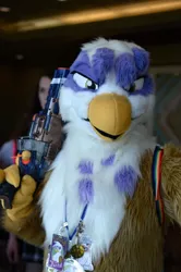 Size: 600x901 | Tagged: safe, artist:neouka, artist:spainfischer, derpibooru import, gilda, gryphon, human, fursuit, gun, handgun, irl, irl human, photo, pistol, toy, toy gun