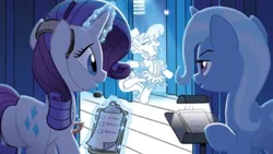 Size: 1136x640 | Tagged: safe, derpibooru import, idw, rarity, sapphire shores, trixie, pony, unicorn, spoiler:comic, spoiler:comicff37, clipboard, curtains, headphones, microphone, paper, plot, rearity, stage, upscaled