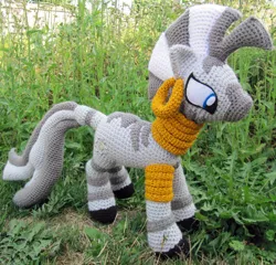 Size: 1024x985 | Tagged: amigurumi, artist:nerdyknitterdesigns, crochet, derpibooru import, grass, irl, photo, plushie, safe, solo, zebra, zecora