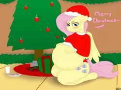 Size: 1280x950 | Tagged: suggestive, artist:theimmortalwolf, derpibooru import, fluttershy, anthro, unguligrade anthro, belly, belly button, blushing, christmas, christmas tree, cookie, explicit source, female, food, hat, holly, kicking, looking at you, milk, preggoshy, pregnant, present, santa hat, solo, solo female, tree