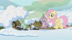 Size: 1280x720 | Tagged: safe, derpibooru import, screencap, fluttershy, spike, dragon, pegasus, pony, skunk, winter wrap up, animal, animal team, burrow, clothes, female, male, mare, nose pinch, plugged nose, skunk spray, smell, smelly, smiling, snow, visible stench, winter, winter wrap up vest