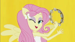Size: 600x337 | Tagged: safe, derpibooru import, screencap, fluttershy, equestria girls, rainbow rocks, animated, better than ever, gif, musical instrument, one eye closed, ponied up, solo, tambourine