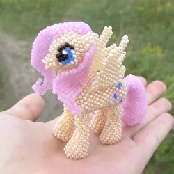 Size: 1500x1500 | Tagged: safe, artist:some-dreamer, derpibooru import, fluttershy, beads, hand, irl, offscreen human, photo