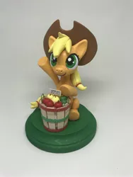 Size: 3024x4032 | Tagged: safe, artist:cadmiumcrab, derpibooru import, applejack, pony, absurd resolution, apple, bucket, craft, food, sculpture, smiling, solo, traditional art, waving