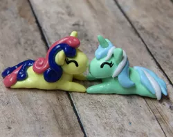 Size: 3810x3027 | Tagged: safe, artist:vivalahill, derpibooru import, bon bon, lyra heartstrings, sweetie drops, pony, craft, eyes closed, female, irl, lesbian, lyrabon, photo, prone, sculpture, shipping, traditional art