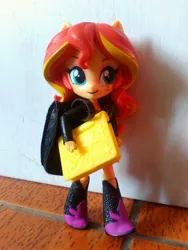 Size: 1944x2592 | Tagged: safe, derpibooru import, sunset shimmer, equestria girls, backpack, book, boots, clothes, doll, equestria girls minis, high heel boots, jacket, solo, studying, toy