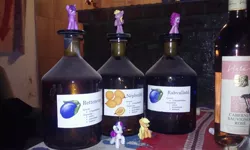 Size: 2560x1536 | Tagged: alcohol, applejack, derpibooru import, figure, hungarian, hungary, irl, palinka, photo, pinkie pie, rarity, safe, toy, translated in the description, twilight sparkle