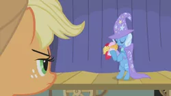 Size: 1280x720 | Tagged: safe, derpibooru import, screencap, applejack, trixie, earth pony, pony, unicorn, boast busters, bipedal, bouquet, cape, clothes, cute, diatrixes, eyes closed, female, flower, freckles, hat, mare, trixie's cape, trixie's hat