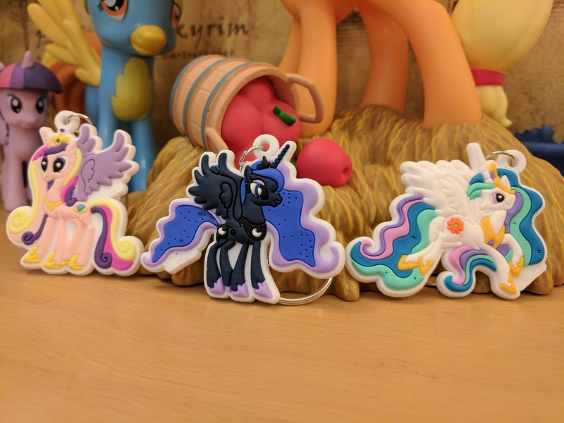 Size: 4048x3036 | Tagged: safe, derpibooru import, photographer:captaincakewalk, applejack, princess cadance, princess celestia, princess luna, spitfire, twilight sparkle, twilight sparkle (alicorn), alicorn, pony, absurd resolution, bootleg, coin bank, diamond select toys, funko, keychain, merchandise, mystery mini, toy