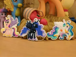 Size: 4048x3036 | Tagged: safe, derpibooru import, photographer:captaincakewalk, applejack, princess cadance, princess celestia, princess luna, spitfire, twilight sparkle, twilight sparkle (alicorn), alicorn, pony, absurd resolution, bootleg, coin bank, diamond select toys, funko, keychain, merchandise, mystery mini, toy