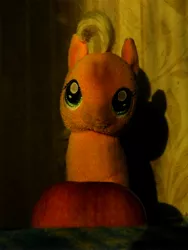 Size: 3456x4608 | Tagged: safe, artist:mfg637, derpibooru import, applejack, earth pony, pony, absurd resolution, apple, female, food, irl, light and dark, looking at you, mare, photo, plushie, solo, sun light