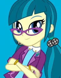 Size: 434x554 | Tagged: safe, derpibooru import, official, screencap, juniper montage, equestria girls, movie magic, spoiler:eqg specials, baubles, blue background, bracelet, clothes, crossed arms, female, glasses, hair tie, jewelry, lapel pin, looking at you, pigtails, shirt, simple background, smiling, solo, twintails
