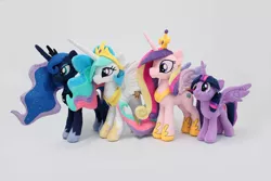 Size: 5184x3456 | Tagged: safe, artist:nekokevin, derpibooru import, princess cadance, princess celestia, princess luna, twilight sparkle, twilight sparkle (alicorn), alicorn, pony, absurd resolution, alicorn tetrarchy, cute, irl, photo, plushie, simple background, smiling, spread wings, twiabetes, white background