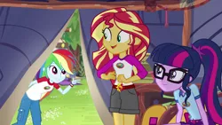 Size: 1280x720 | Tagged: safe, derpibooru import, screencap, rainbow dash, sci-twi, sunset shimmer, twilight sparkle, equestria girls, legend of everfree, bracelet, camp everfree outfits, clothes, jewelry, pants, shorts, smiling, sun, tent, tree, wristband